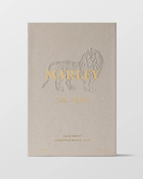 Beige packaging of a perfume with a lion emblem and 'Marley' branding on a white background 