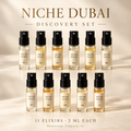 Niche Dubai Discovery Set with eleven 2 ml fragrance samples, Elixirs 01–11, arranged in two rows on an ivory background.